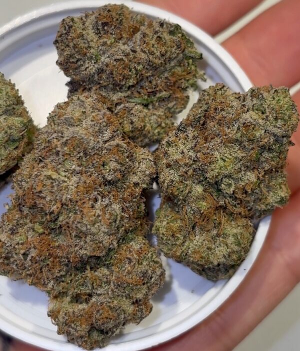 Melon Berry strain nugs with orange pistils and trichomes