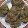 Surefire Selections Melon Berry frosty cannabis buds close up